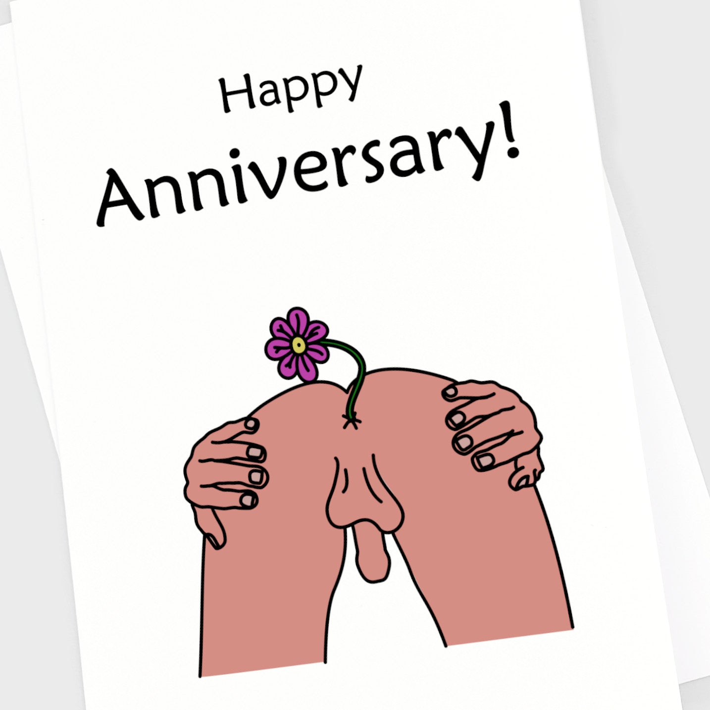 Close up of a naughty anniversary card of a man's bum with a flower coming out of it.